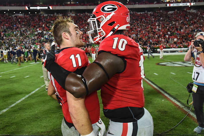 Malik Herring and Jake Fromm celebrate the Notre Dame victory.