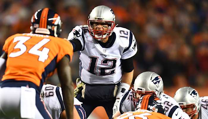 New England Patriots quarterback Tom Brady (12) calls out over center David Andrews (60) and offensive guard Joe Thuney (62) and offensive tackle Nate Solder (77) in the second quarter at Sports Authority Field.