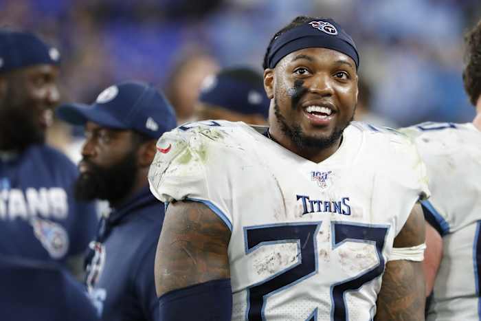 Tennessee Titans running back Derrick Henry (22) smiles on the bench against the Baltimore Ravens in the final minute of the fourth quarter in a AFC Divisional Round playoff football game at M&T Bank Stadium.