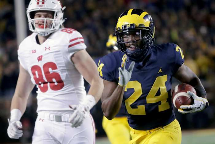 Hill returns an interception against Wisconsin in 2018; Photo credit: Milwaukee Journal Sentinel