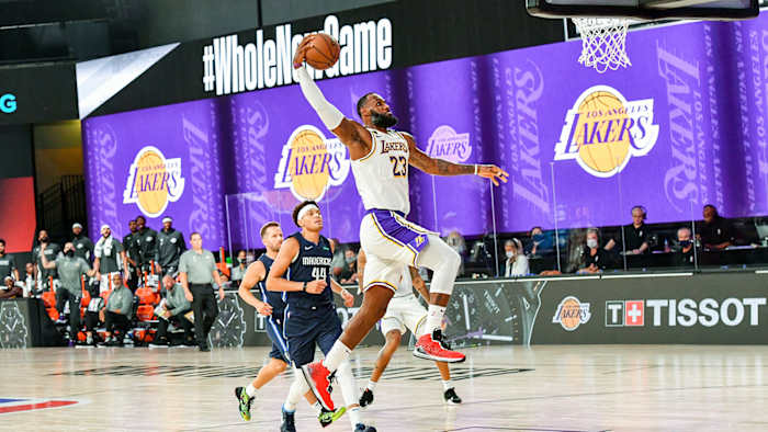 LeBron James of the Lakers dunks the ball