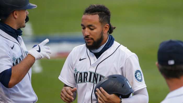 J.P. Crawford is congratulated after scoring