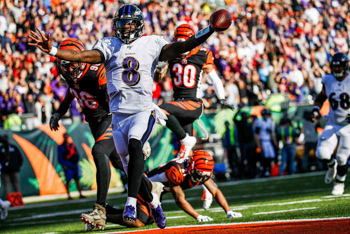 Lamar Jackson scores on a long touchdown run against the Bengals