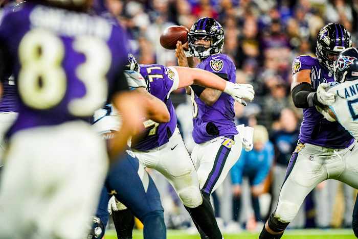 Lamar Jackson throws a pass during the 2019-20 playoffs