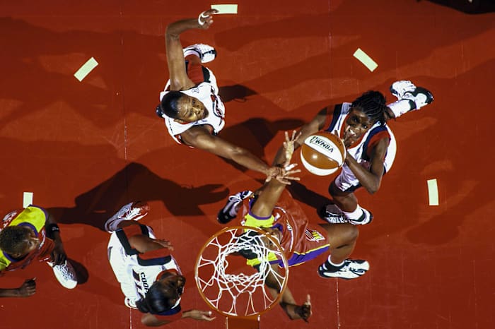 An aerial shot of Sheryl Swoopes shooting the ball