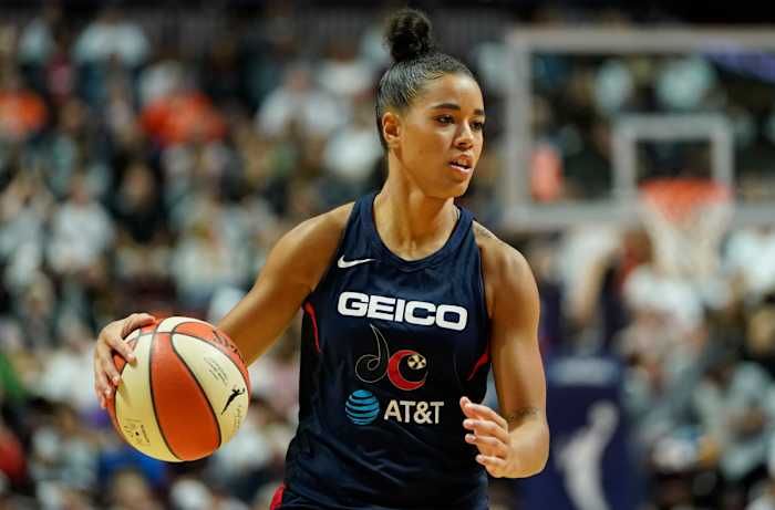 Natasha Cloud dribbles