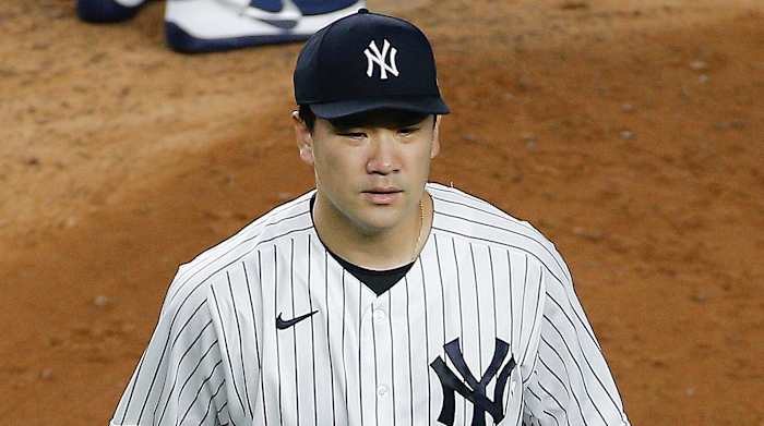 New York Yankees starting pitcher Masahiro Tanaka (19) leaves the mound after being taken out of the game against the Tampa Bay Rays during the fifth inning at Yankee Stadium.