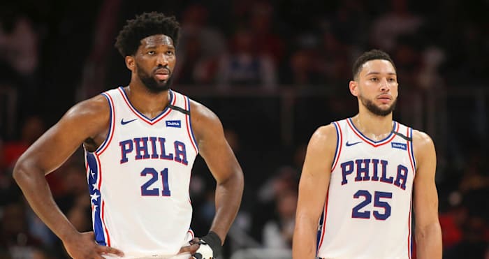 Philadelphia 76ers center Joel Embiid (21) and guard Ben Simmons (25) during a free throw against the Atlanta Hawks in the second quarter at State Farm Arena.