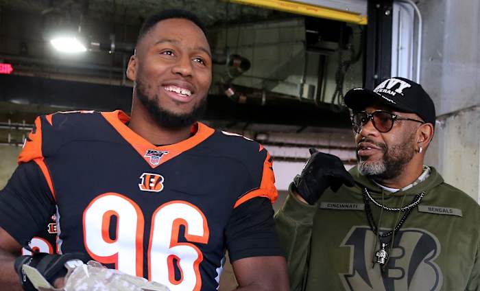 Cincinnati Bengals defensive end Carlos Dunlap (96) gets set to take the field alongside his father before of kickoff of a Week 10 NFL game against the Baltimore Ravens, Sunday, Nov. 10, 2019, at Paul Brown Stadium in Cincinnati. Baltimore Ravens At Cincinnati Bengals Nov 10 Nfl Week 10
