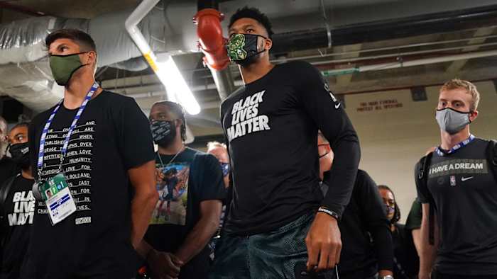 The Milwaukee Bucks hold a meeting after protesting playoff game against the Orlando Magic after Jacob Blake shooting.