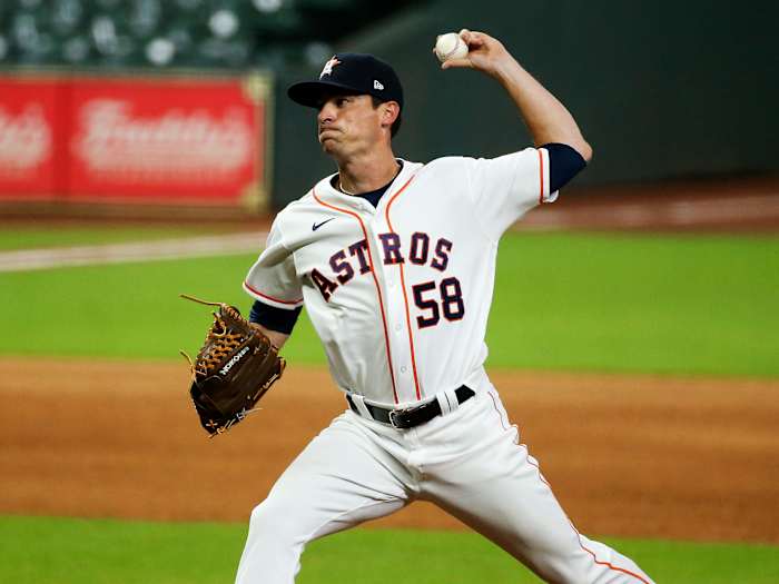 Aug 12, 2020; Houston, Texas, USA; Houston Astros relief pitcher Brooks Raley (58) delivers a pitch against the San Francisco Giants during the seventh inning at Minute Maid Park.
