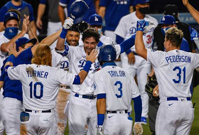 Aug 22, 2020; Los Angeles, California, USA; Los Angeles Dodgers first basemen Cody Bellinger (35) celebrates hitting a walkout home run to beat the Colorado Rockies 4-3 at Dodger Stadium. Mandatory Credit: Robert Hanashiro-USA TODAY Sports