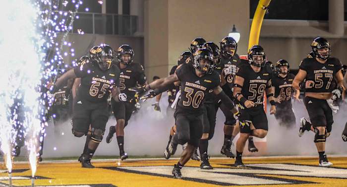 The Southern Miss Golden Eagles run onto the field at M.M. Roberts Stadium for their game against the South Alabama Jaguars in Hattiesburg, Miss., Thursday, Sept. 3, 2020.