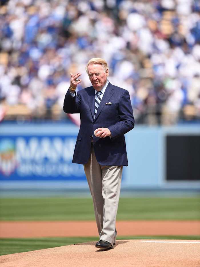 Vin Scully stands on the mound