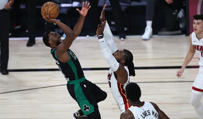 Boston Celtics guard Kemba Walker (8) goes up for a shot while Miami Heat forward Jae Crowder (99) defends during the second half in game one of the Eastern Conference Finals of the 2020 NBA Playoffs