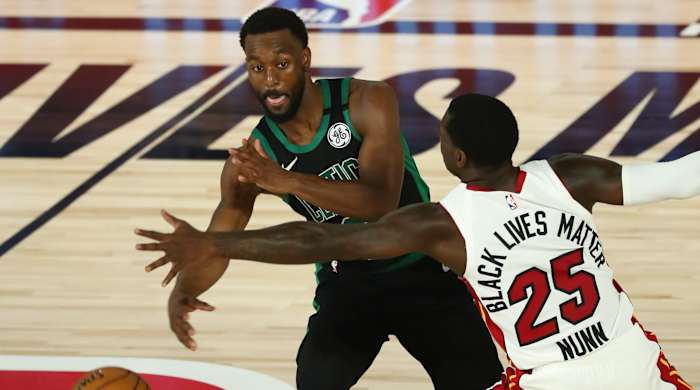 Boston Celtics guard Kemba Walker (8) passes the ball while Miami Heat guard Kendrick Nunn (25) defends during the second half in game one of the Eastern Conference Finals of the 2020 NBA Playoffs