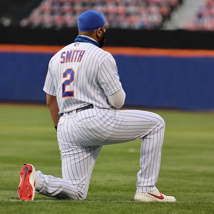 Dom Smith kneeling