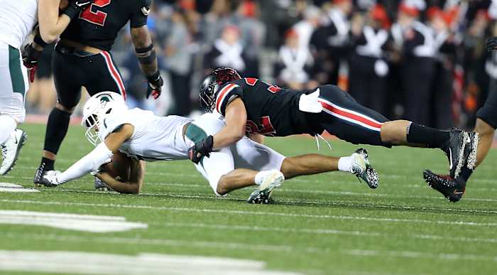 Linebacker Tuf Borland making a tackle vs. Michigan State last season.