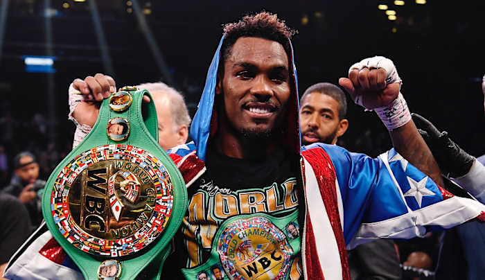 Jermall Charlo (blue and red trunks) reacts after knocking out Dennis Hogan of Ireland (white trunk) in the seventh round during a middleweight world championship fight at Barclays Center.