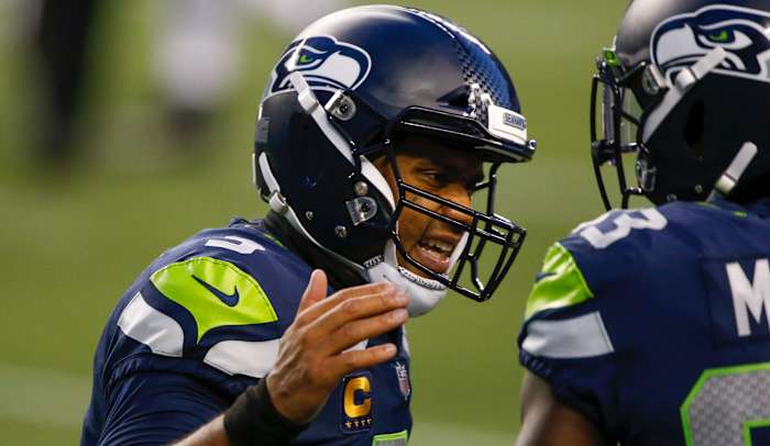 Seattle Seahawks quarterback Russell Wilson (3) reacts after throwing a touchdown pass against the New England Patriots during the third quarter at CenturyLink Field.