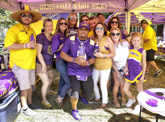 The Cajun Tiger Tailgating crew poses for a group photo during their tailgate Saturday in Baton Rouge.
