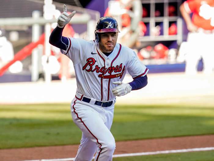 Sep 30, 2020; Cumberland, Georgia, USA; Atlanta Braves first baseman Freddie Freeman (5) reacts after singling to score the game winning run against the Cincinnati Reds during the thirteenth inning at Truist Park.