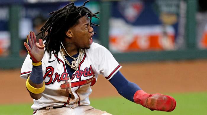 Oct 6, 2020; Houston, Texas, USA; Atlanta Braves center fielder Ronald Acuna Jr. (13) celebrates after scoring a run the 3rd inning against the Miami Marlins during game one of the 2020 NLDS at Minute Maid Park.