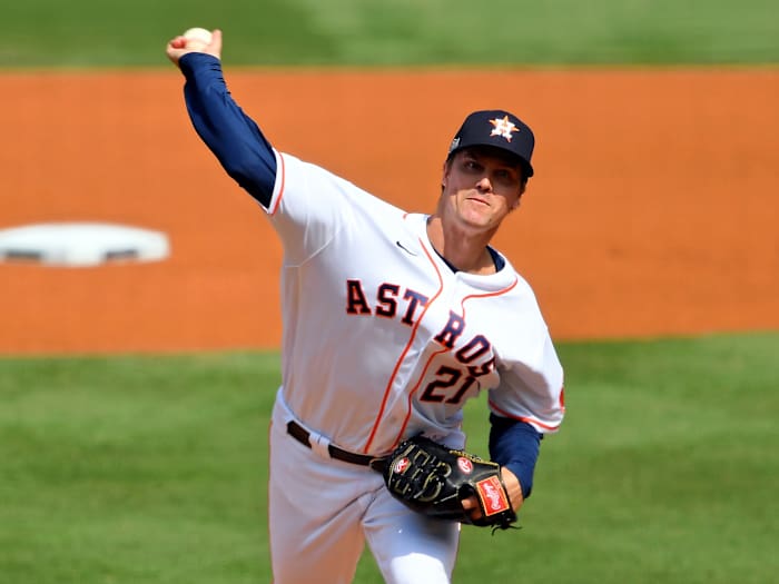 Oct 8, 2020; Los Angeles, California, USA; Houston Astros starting pitcher Zack Greinke (21) pitches against the Oakland Athletics during the first inning during game four of the 2020 ALDS at Dodger Stadium.