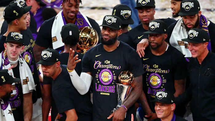 Los Angeles Lakers forward LeBron James (23) holds up four fingers after winning his fourth NBA championship after game six of the 2020 NBA Finals at AdventHealth Arena. The Los Angeles Lakers won 106...