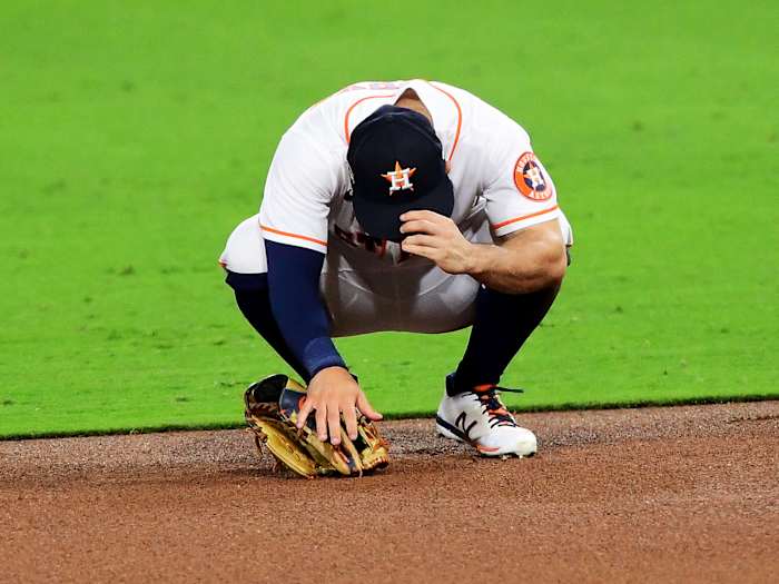 Oct 13, 2020; San Diego, California, USA; Houston Astros second baseman Jose Altuve (27) reacts after committing an error against the Tampa Bay Rays during the sixth inning in game three of the 2020 ALCS at Petco Park.
