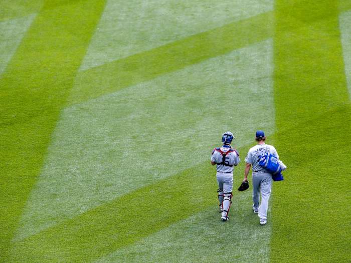 Clayton Kershaw walking with a teammate