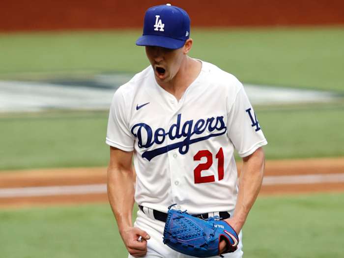 Los Angeles Dodgers starting pitcher Walker Buehler (21) reacts after a strike out in the sixth inning against the Atlanta Braves during game six of the 2020 NLCS at Globe Life Field.
