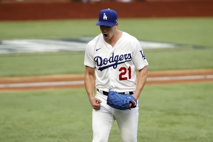 Oct 17, 2020; Arlington, Texas, USA; Los Angeles Dodgers starting pitcher Walker Buehler (21) reacts after a strike out in the sixth inning against the Atlanta Braves during game six of the 2020 NLCS at Globe Life Field. Mandatory Credit: Tim Heitman-USA TODAY Sports