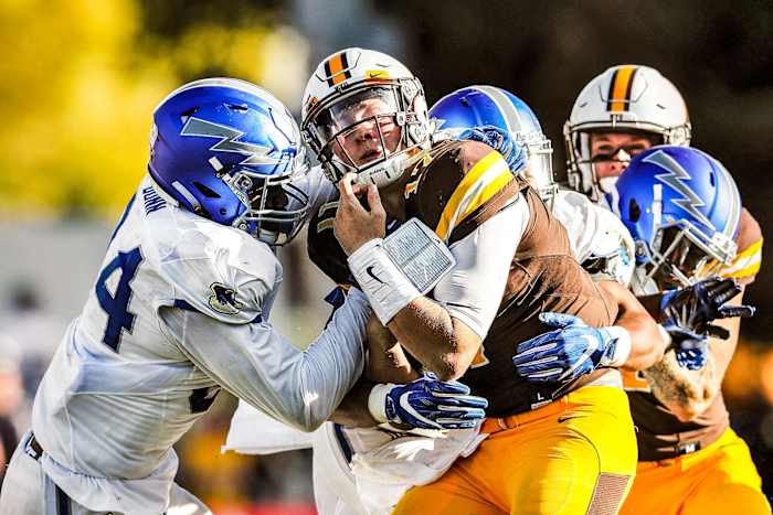 Josh Allen, playing at Wyoming, is sacked by Air Force defenders