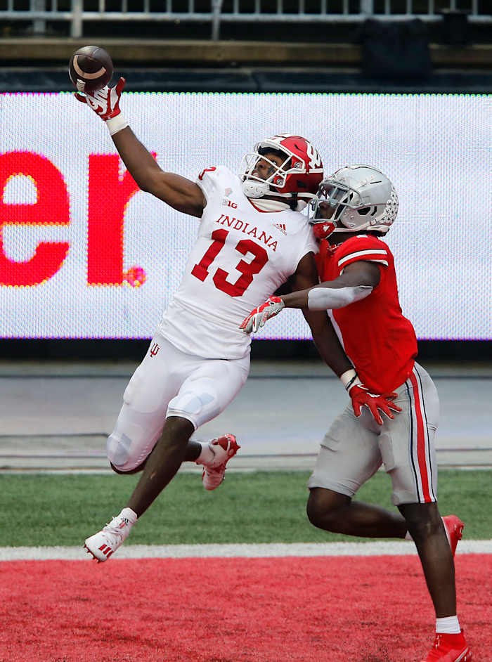 Indiana Hoosiers wide receiver Miles Marshall (13) goes up for the pass while defended by Ohio State Buckeyes cornerback Sevyn Banks (7)during the first quarter at Ohio Stadium.
