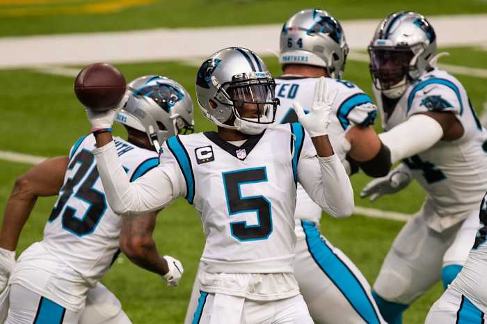 Carolina Panthers quarterback Teddy Bridgewater (5) warms up before the game against the Minnesota Vikings at U.S. Bank Stadium.