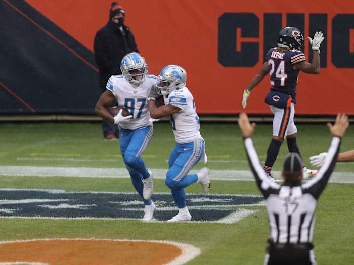 Cephus is congratulated for scoring a touchdown against the Chicago Bears.