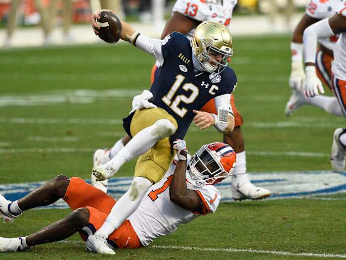 Notre Dame QB Ian Book is sacked by the Clemson defense