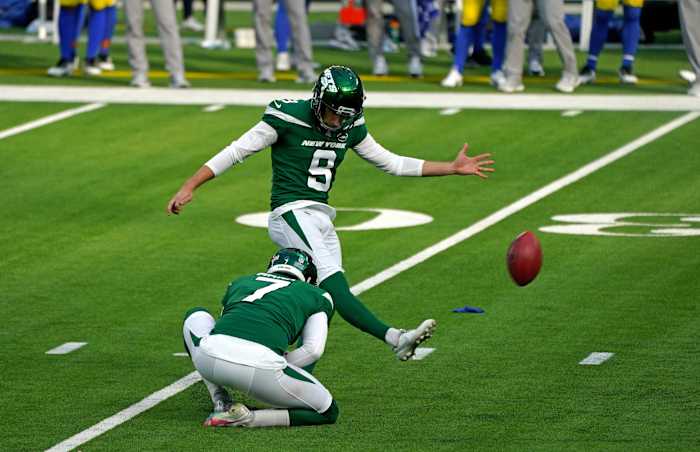 Jets K Sam Ficken kicking field goal with Braden Mann holding