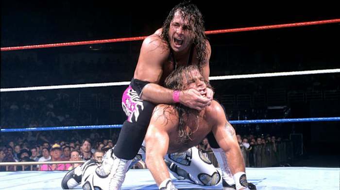 WWE's Bret Hart performs a submission maneuver on Shawn Michaels