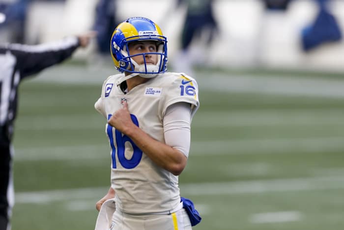 Los Angeles Rams quarterback Jared Goff (16) returns to the sideline following a turnover on downs against the Seattle Seahawks during the third quarter at Lumen Field.