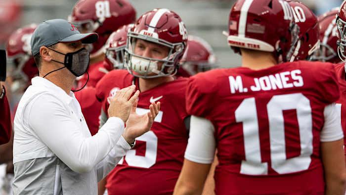 Alabama offensive coordinator Steve Sarkisian, acting as head coach during head coach Nick Saban's COVID-19 quarantine, takes the field with the team for warmups at Bryant-Denny Stadium for the Iron Bowl