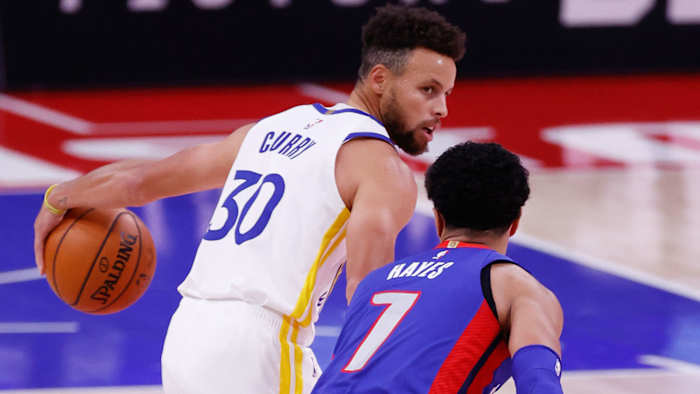 Golden State Warriors guard Stephen Curry is defended by Detroit Pistons guard Killian Hayes