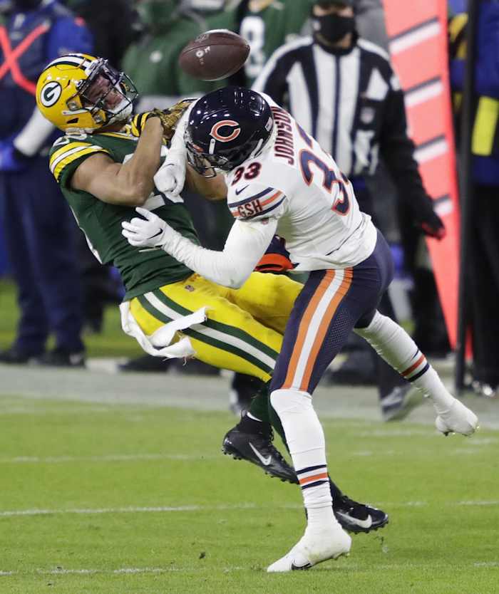 Green Bay Packers wide receiver Allen Lazard (13) is hit hard by Chicago Bears cornerback Jaylon Johnson (33) in the third quarter during their football game Sunday, November 29, 2020, at Lambeau Field in Green Bay, Wis.