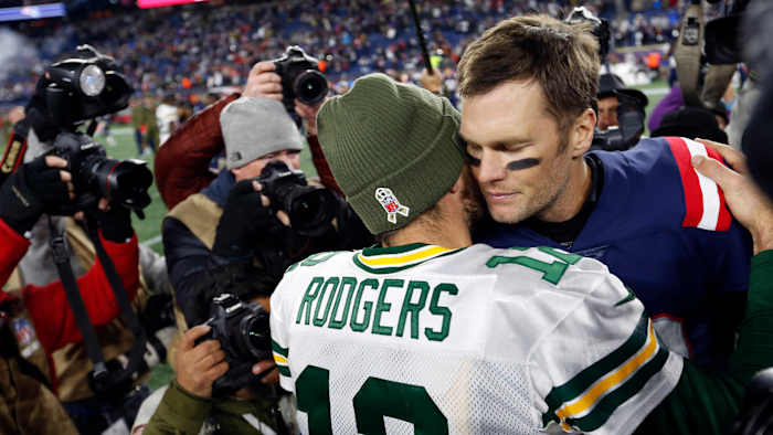 Aaron Rodgers and Tom Brady embrace after Patriots victory over Packers in 2018