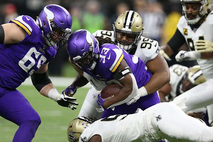 Jan 5, 2020; New Orleans, Louisiana, USA; New Orleans defensive tackle Shy Tuttle (99) tackles Vikings running back Dalvin Cook (33) during the first quarter of a NFC Wild Card playoff football game at the Mercedes-Benz Superdome. Mandatory Credit: Chuck Cook -USA TODAY Sports