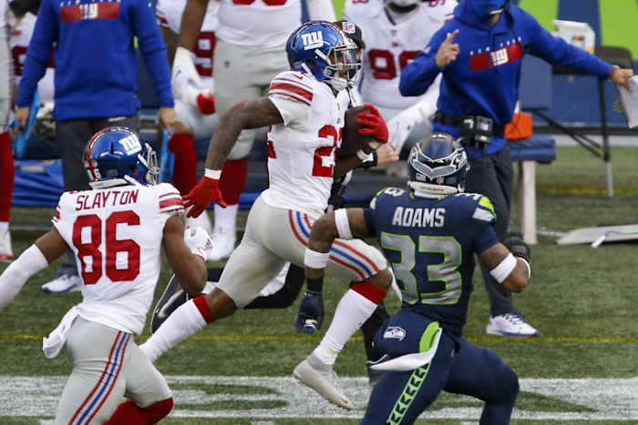 Dec 6, 2020; Seattle, Washington, USA; New York Giants running back Wayne Gallman (22) rushes against the Seattle Seahawks during the third quarter at Lumen Field.