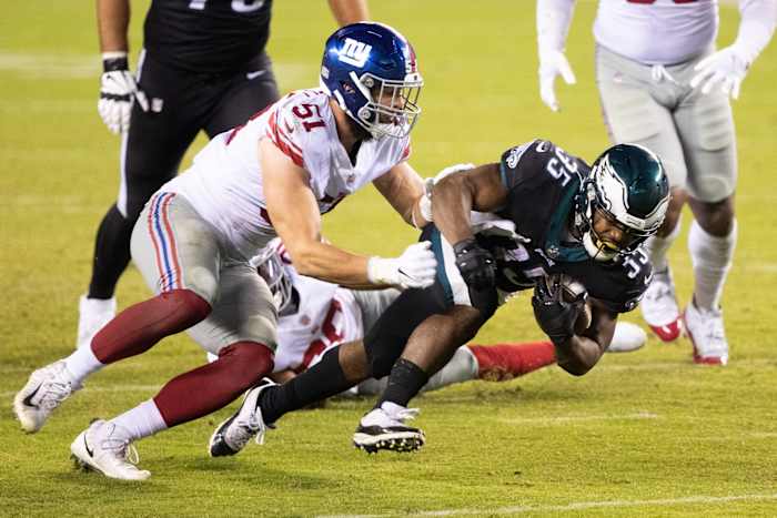 Oct 22, 2020; Philadelphia, Pennsylvania, USA; Philadelphia Eagles running back Boston Scott (35) runs with the ball against New York Giants outside linebacker Kyler Fackrell (51) during the fourth quarter at Lincoln Financial Field.