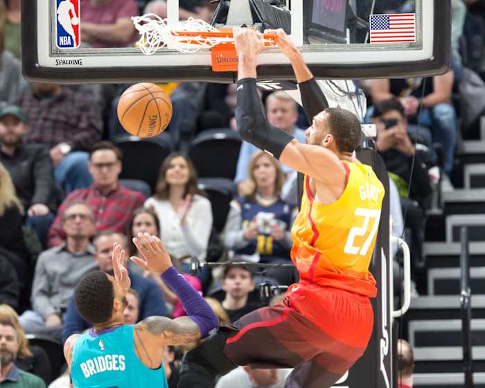 Rudy Gobert (27) dunks over Miles Bridges (0) in a game between the Utah Jazz and Charlotte Hornets
