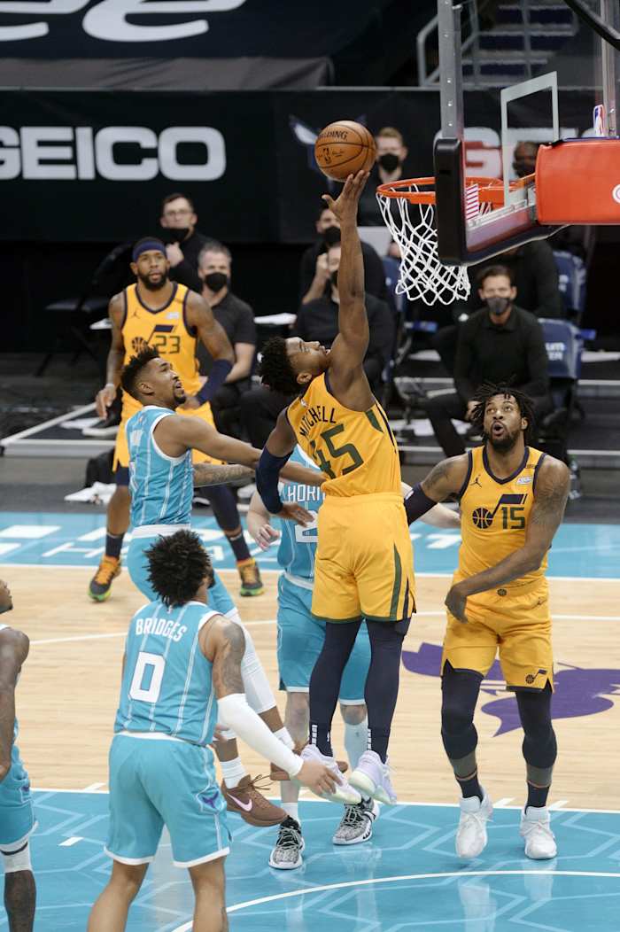 Donovan Mitchell (45) scores a layup against the Charlotte Hornets